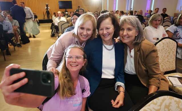 BYU student Lydia Fuller takes a photo with Sister Amy A. Wright, first counselor in the Primary general presidency, President Susan H. Porter, Primary general president, and Sister J. Anette Dennis, first counselor in the Relief Society general presidency, prior to a conference at the Hinckley Center Assembly Hall at BYU in Provo on Thursday, Sept. 25, 2025. The conference marks the 30th anniversary on "The Family Proclamation."