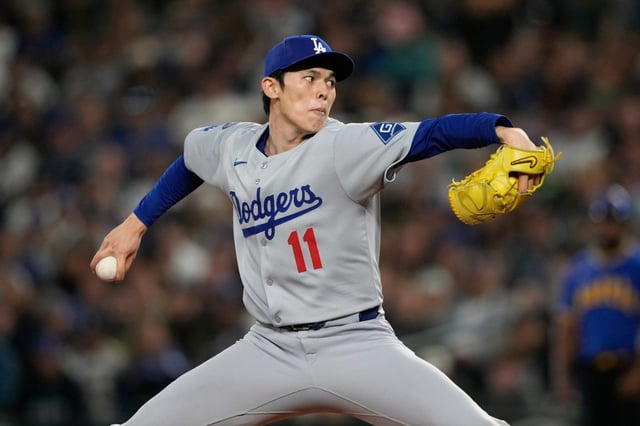 Dodgers relief pitcher Roki Sasaki throws to the plate during the seventh inning of their 3-2 victory over the Seattle Mariners on Friday night in Seattle. (AP Photo/Ryan Sun)
