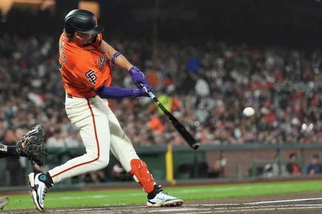 Giants shortstop Willy Adames hits a two-run home run during the first inning of Friday's game against the Rockies at Oracle Park. 