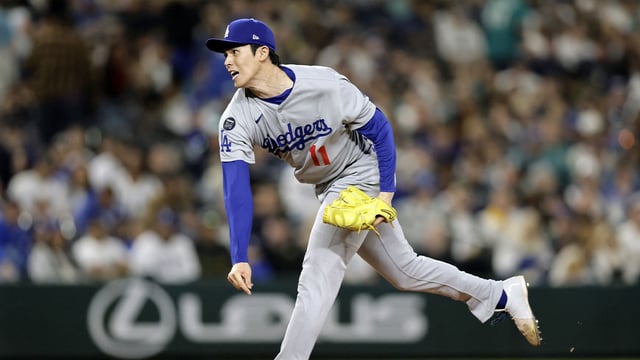 Sep 26, 2025; Seattle, Washington, USA; Los Angeles Dodgers pitcher Roki Sasaki (11) throws against the Seattle Mariners at T-Mobile Park. Mandatory Credit: John Froschauer-Imagn Images