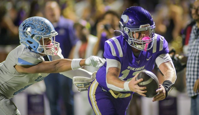 Valencia quarterback, Brady Bretthauer (r) dives into the end zone to score on a 35-yard rushing touchdown as Saugus’ Mono Ortega tries to tackle him Friday, September 26, 2025 at Valencia High School. (Photo by Kevin Karzin, Contributing Photographer)