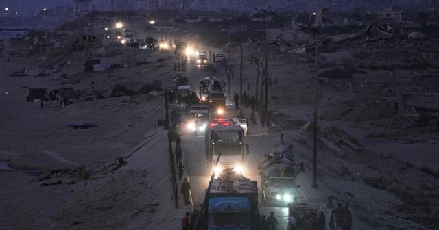 Displaced Palestinians flee northern Gaza along the coastal road near Wadi Gaza. AP