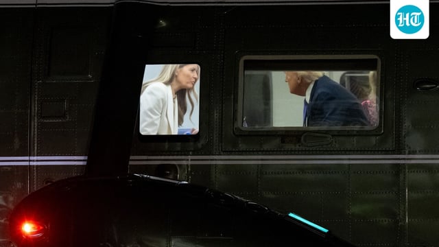 US President Donald Trump speaks with First Lady Melania Trump onboard Marine One after arriving on the South Lawn of the White House