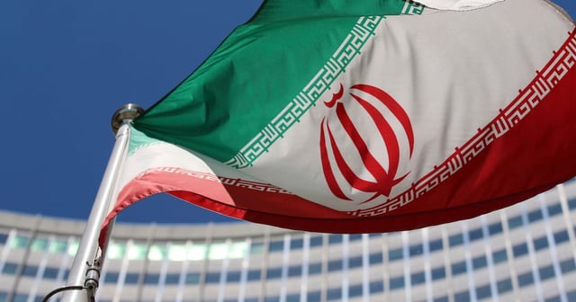 The Iranian flag flies in front of a UN building in Vienna.  AP