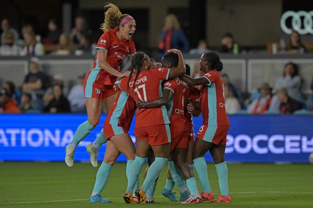 Kansas City Current forward Temwa Chawinga (6) is mobbed by her teammates after scoring a goal against Bay FC on Oct. 12, 2024. (Jose Carlos Fajardo/Bay Area News Group)
