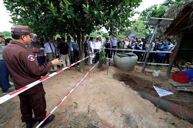 This pool photo taken and released on August 22, 2025 by Agence Kampuchea Presse (AKP) shows a bomb dropped by the Thai military during the July border clashes between Cambodia and Thailand in a village in Oddar Meanchey province. A long-running border row between the Southeast Asian neighbours boiled over into conflict in July involving artillery bombardments, air strikes and infantry clashes, killing at least 43 people and forcing more than 300,000 others to flee their homes. (Photo by POOL / AFP) (Photo by STR/POOL/AFP via Getty Images)