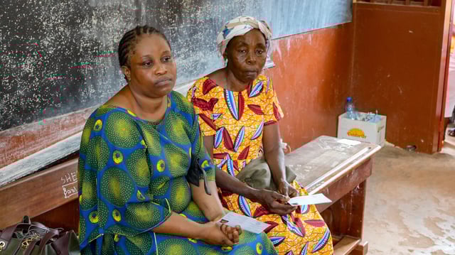 Women wait to cast their votes at a polling station in Libreville, Gabon, Saturday, Sept. 27, 2025. (AP Photo/Betines Makosso)