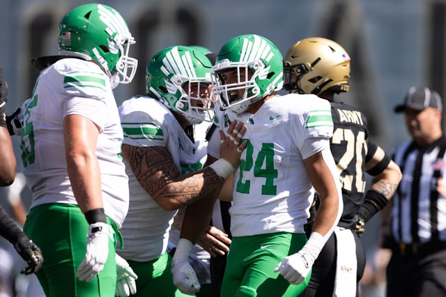 Caleb Hawkins #24 of the North Texas Mean Green reacts after rushing during the first half of the game against the Army Black Knights at Michie Stadium on September 20, 2025 in West Point, New York.