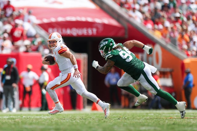 Sep 21, 2025; Tampa, Florida, USA; Tampa Bay Buccaneers quarterback Baker Mayfield (6) is chased by New York Jets defensive end Tyler Baron (94)  at Raymond James Stadium. Mandatory Credit: Nathan Ray Seebeck-Imagn Images/File Photo