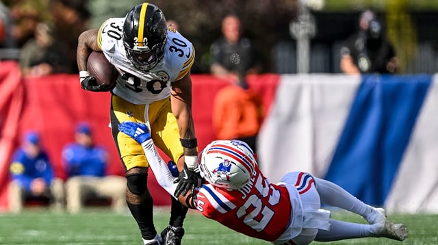 Sep 21, 2025; Foxborough, Massachusetts, USA; New England Patriots cornerback Marcus Jones (25) attempts to tackle Pittsburgh Steelers running back Jaylen Warren (30) during the fourth quarter at Gillette Stadium. Mandatory Credit: Brian Fluharty-Imagn Images