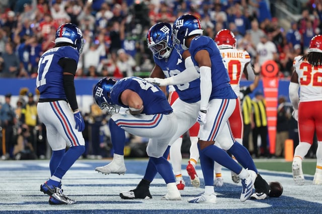 Cam Skattebo, second from left, celebrates his rushing touchdown with his New York Giants teammates during the second quarter against the Kansas City Chiefs on Sunday, September 21, 2025, in East Rutherford, New Jersey. (Photo by Sarah Stier/Getty Images)