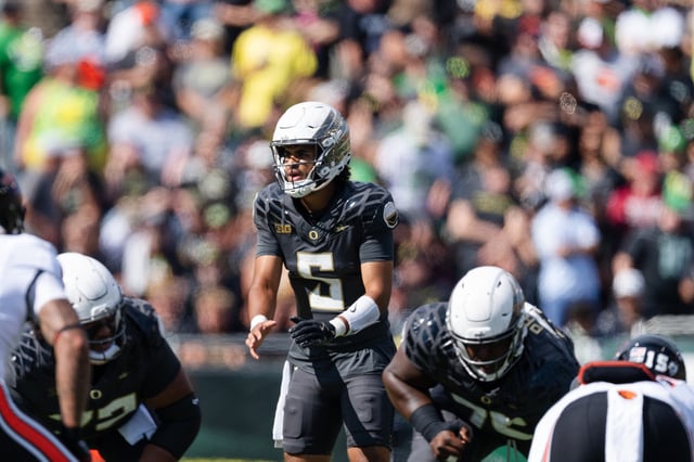 EUGENE, OREGON - SEPTEMBER 20:  Quarterback Dante Moore #5 of the Oregon Ducks prepares for a snap during the first half of the game against the Oregon State Beavers at Autzen Stadium on September 20, 2025 in Eugene, Oregon. (Photo by Ali Gradischer/Getty Images)