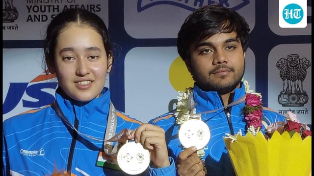 Rashmika Sahgal and Kapil pose with their air pistol mixed team gold medal at the ISSF Junior World Cup in Delhi on Saturday. (HT Photo)