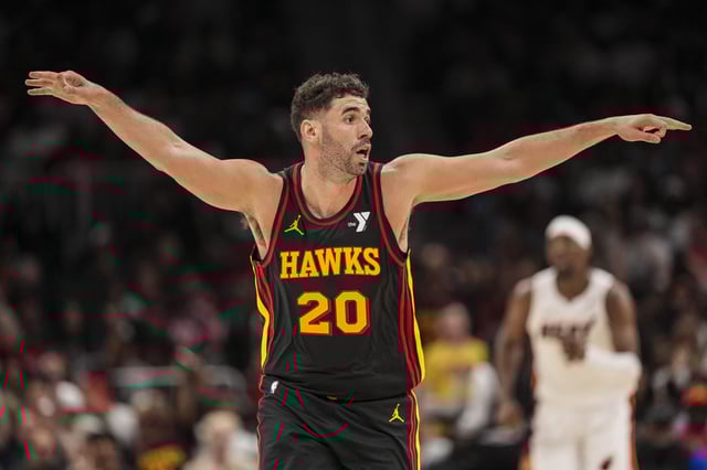 Apr 18, 2025; Atlanta, Georgia, USA; Atlanta Hawks forward Georges Niang (20) reacts after making a three point shot against the Miami Heat during the second half at State Farm Arena. Mandatory Credit: Dale Zanine-Imagn Images/File Photo