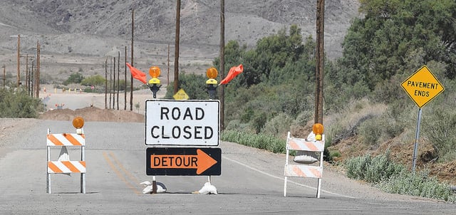 Now a common sight in the Wellton-Mohawk Valley and Dome Valley are road closure signs wherever county roads cross the flooded Gila River, Monday, May 1, 2023. (Randy Hoeft/Yuma Sun via AP)