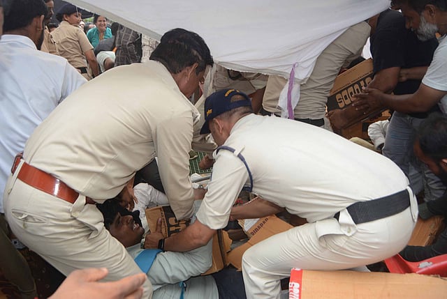 The scene descended into chaos with people elbowing and scuffling, trying to grab helmets from others