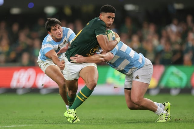 South Africa fly-half Sacha Feinberg-Mngomezulu (C) about to score a try against Argentina in Durban.