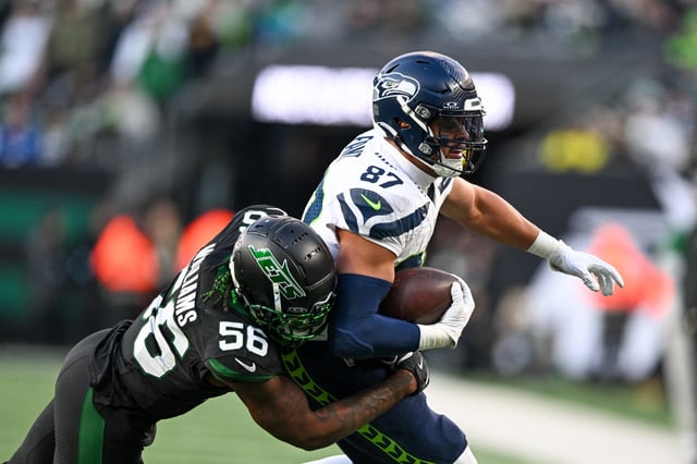 Dec 1, 2024; East Rutherford, New Jersey, USA; Seattle Seahawks tight end Noah Fant (87) runs with the ball during the third quarter and is tackled by New York Jets linebacker Quincy Williams (56) at MetLife Stadium. Mandatory Credit: Mark Smith-Imagn Images/File Photo