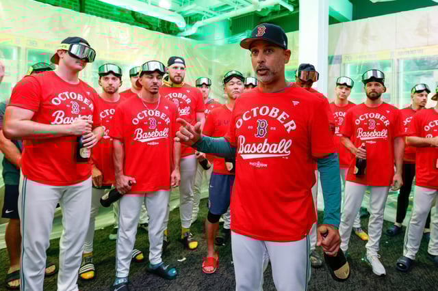 Boston Red Sox head coach Alex Cora speaks in the locker room after defeating the Detroit Tigers in a baseball game, Friday, Sept. 26, 2025, in Boston. (AP Photo/Greg M. Cooper)