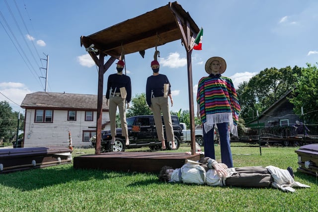 The display built by Second Ward resident Mark Rodriguez, pictured on Saturday, has elicited criticism online.