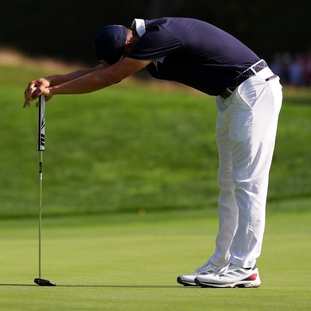 United States' Collin Morikawa reacts after missing a putt on the 13th hole at Bethpage Black golf course during the Ryder Cup golf tournament, Saturday, Sept. 27, 2025, in Farmingdale, N.Y. (AP Photo/Lindsey Wasson)