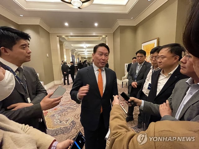 SK Group Chairman Chey Tae-won (C) speaks to reporters on the sidelines of the 2025 Trans-Pacific Dialogue hosted by the Chey Institute for Advanced Studies at a hotel in Washington, D.C., on Feb. 21, 2025, in this file photo. (Pool photo) (Yonhap)
