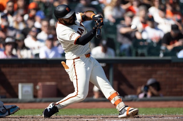 Giants left fielder Heliot Ramos hits a single during the sixth inning of Saturday’s game against the Colorado Rockies at Oracle Park. 