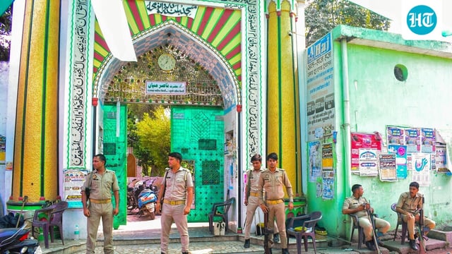 Police personnel stand guard outside a dargah, a day after clashes between police and locals, in Bareilly, Uttar Pradesh, Saturday, Sept. 27, 2025. 