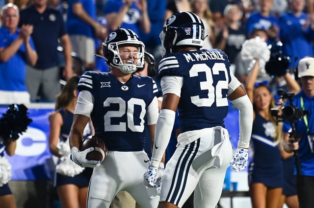 Brigham Young Cougars cornerback Cannon DeVries (20) celebrates a play with Portland State linebacker John Amone (32) during the second half of an NCAA college football game against Portland State, Saturday, Aug. 30, 2025 in Provo. (AP Photo/Alex Goodlett)