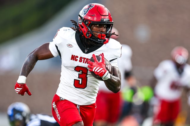 Hollywood Smothers #3 of the North Carolina State Wolfpack runs the ball during the second half of a football game against the Duke Blue Devils at Wallace Wade Stadium on September 20, 2025 in Durham, North Carolina.