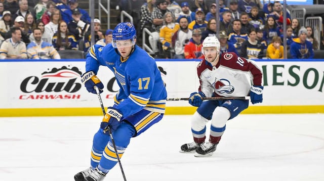 Apr 5, 2025; St. Louis, Missouri, USA; St. Louis Blues defenseman Cam Fowler (17) controls the puck against the Colorado Avalanche during the first period at Enterprise Center. Mandatory Credit: Jeff Curry-Imagn Images