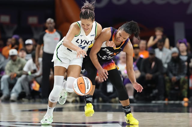 PHOENIX, ARIZONA - SEPTEMBER 26: Napheesa Collier #24 of the Minnesota Lynx and Alyssa Thomas #25 of the Phoenix Mercury battle for a loose ball during the first half of Game Three of the 2025 WNBA Playoffs semifinals at PHX Arena on September 26, 2025 in Phoenix, Arizona. NOTE TO USER: User expressly acknowledges and agrees that, by downloading and or using this photograph, User is consenting to the terms and conditions of the Getty Images License Agreement. (Photo by Christian Petersen/Getty Images)