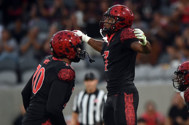 SAN DIEGO, CA – AUGUST 28: San Diego State Aztecs running back Lucky Sutton (7) celebrates with San Diego State Aztecs offensive lineman Christian Jones (70) after scoring a touchdown during the college football game between the Stony Brook Seawolves and the San Diego State Aztecs on August 28, 2025, at Snapdragon Stadium in San Diego, CA. (Photo by Chris Williams/Icon Sportswire via Getty Images)