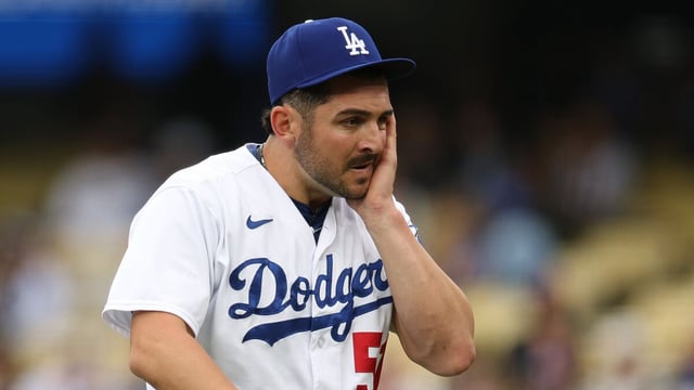 LOS ANGELES, CALIFORNIA - MAY 31: Alex Vesia #51 of the Los Angeles Dodgers reacts as he walks back to the dugout.