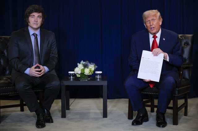 NEW YORK, NEW YORK - SEPTEMBER 23: U.S. President Donald Trump (R) holds a printout of his social media post as he speaks with President of Argentina Javier Milei during a bilateral meeting at the 80th session of the UN’s General Assembly (UNGA) at the United Nations headquarters on September 23, 2025 in New York City. World leaders convened for the 80th Session of UNGA, with this year’s theme for the annual global meeting being “Better together: 80 years and more for peace, development and human rights.” (Photo by Chip Somodevilla/Getty Images)