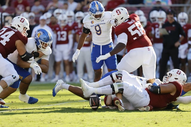 Stanford quarterback Ben Gulbranson fumbles the ball during the first half of Saturday’s game against San Jose State at Stanford Stadium.