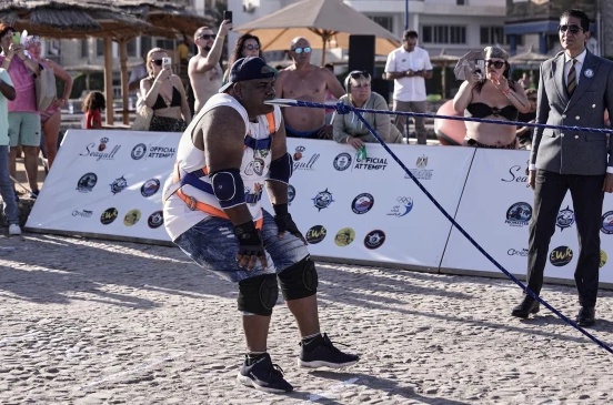Egyptian wrestler Ashraf Mahrous, better known as Kabonga, pulls a ship across the water with a rope held only by his teeth at the marina of the Red Sea resort of Hurghada, Egypt, on Saturday.