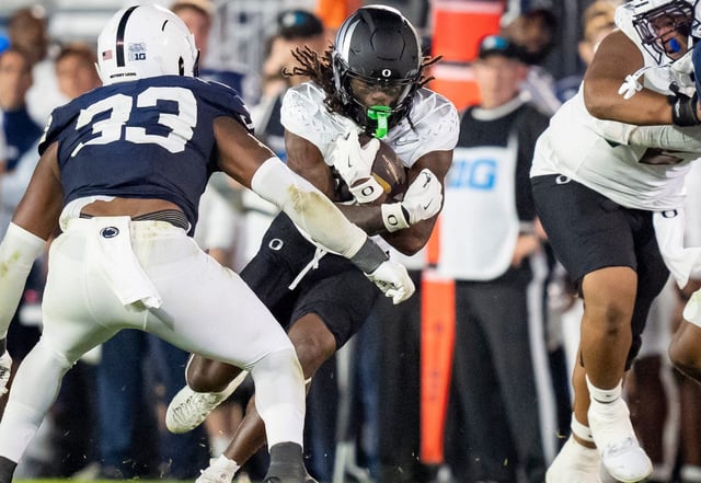 Oregon running back Jayden Limar carries the ball during his team's game against Penn State at Beaver Stadium.