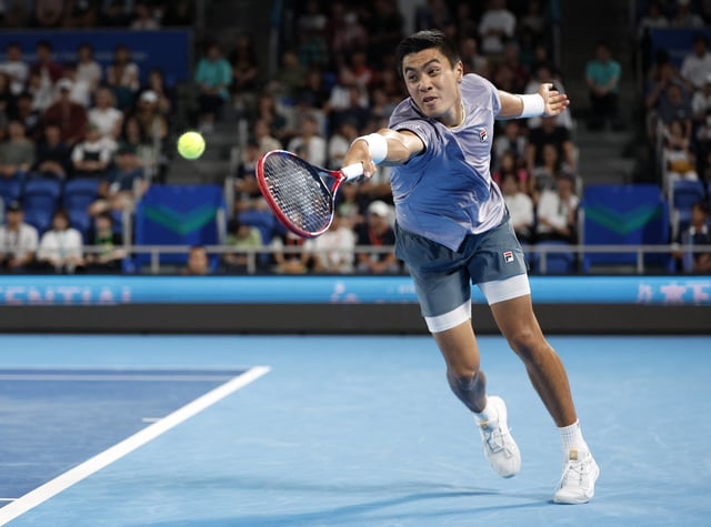 Tennis - ATP 500 - Japan Open Tennis Championships - Ariake Coliseum, Tokyo, Japan - September 28, 2025 Brandon Nakashima of the U.S. in action during his quarter final match against Spain's Carlos Alcaraz REUTERS/Manami Yamada