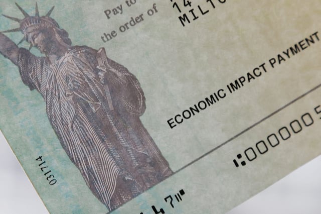 A COVID-19 stimulus check from the U.S. Treasury arrived in the mail for a family based in Milton, Massachusetts on March 25, 2021.