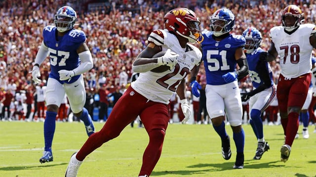 Sep 7, 2025; Landover, Maryland, USA; Washington Commanders running back Jacory Croskey-Merritt (22) scores a touchdown during the second quarter against the New York Giants at Northwest Stadium. Mandatory Credit: Peter Casey-Imagn Images