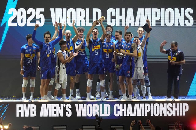 Team Italy celebrates with the trophy after defeating Bulgaria in their final match at the 2025 FIVB Volleyball Men's World Championship at the Mall of Asia Arena, Pasay city, Philippines on Sunday, Sept. 28, 2025. (AP Photo/Aaron Favila)