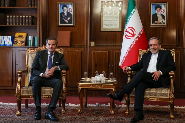Iran's Foreign Minister Abbas Araghchi (R) and International Atomic Energy Agency (IAEA) Director General Rafael Mariano Grossi pose for a photo before their meeting in Tehran on November 14, 2024.