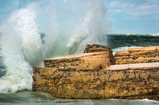 Stock image/file photo: Waves of a heavy surf break in St. Petersburg, Florida.