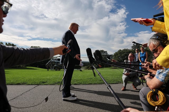 President Donald Trump speaks to the media before departing from the White House on September 26, 2025.