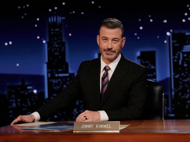 This handout image released by Disney on September 24, 2025, shows Jimmy Kimmel during the taping of "Jimmy Kimmel Live!" at the Capitan Entertainment Centre on September 23, 2025, in Los Angeles, California. TV host Jimmy Kimmel defended free speech when he returned to US screens on September 23, 2025, calling government pressure on his late-night talk show "anti-American" as critics decried his suspension as an attack on constitutional rights. In a lengthy opening monologue, an emotional Kimmel praised the public outrage -- which came from both left and right -- over his suspension, as President Donald Trump threatened to sue ABC, the TV network that carries the show. (Randy Holmes/ABC/AFP)