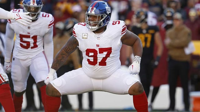 Nov 19, 2023; Landover, Maryland, USA; New York Giants defensive tackle Dexter Lawrence II (97) celebrates after a sack against the Washington Commanders during the second quarter at FedExField. Mandatory Credit: Geoff Burke-Imagn Images