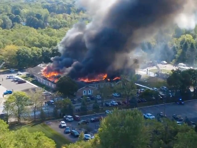In this image taken from video released by Julie J, @Malkowski6April, Massive flames and smoke rise from The Church of Jesus Christ of Latter-day Saints in Grand Blanc, about 50 miles north of Detroit, Sunday, Sept. 28, 2025. (Julie J, @Malkowski6April via AP)