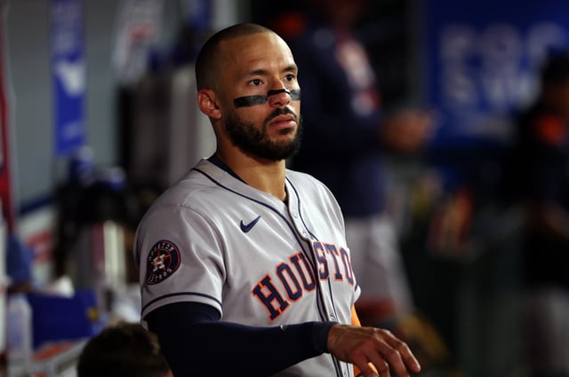 ANAHEIM, CALIFORNIA - SEPTEMBER 27: Carlos Correa #1 of the Houston Astros looks at the scoreboard, after the Cleveland Guardians defeated the Texas Rangers to eliminate the Astros from playoffs, during the second inning of a baseball game against the Los Angeles Angels score at Angel Stadium of Anaheim on September 27, 2025 in Anaheim, California. (Photo by Kevork Djansezian/Getty Images)