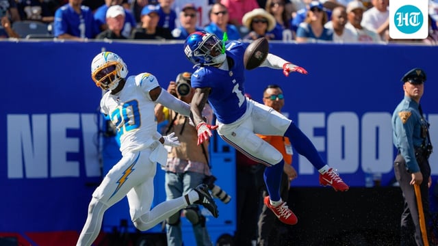 New York Giants wide receiver Malik Nabers (1) reacts as he leaps for a pass against Los Angeles Chargers cornerback Cam Hart (20) 